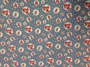 Grijs met roosjes in cirkels. Prachtig voor bv quilt, patchwork, babykleertjes, beddegoed, gordijntje enz