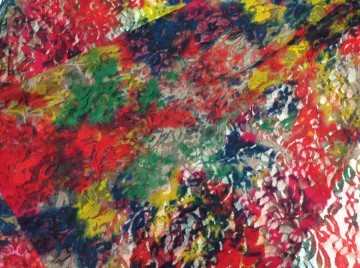 Prachtige rekbare kant met tinten groen, rood, geel en blauw. Als bovenlaag voor een blouse of rokje bv