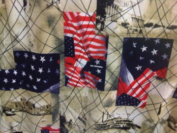 Soepele tricot van viscose/polyester met oa Amerikaanse vlag in beige