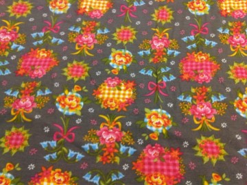 Tricot van katoen, fantasie figuurtjes op taupe